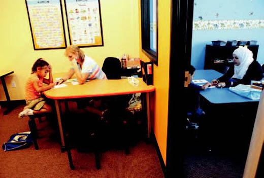 Students work with teachers to help improve reading and math skills.